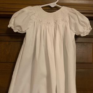 White smocked Petit Ami hand embroidered size on the tag is 6 month